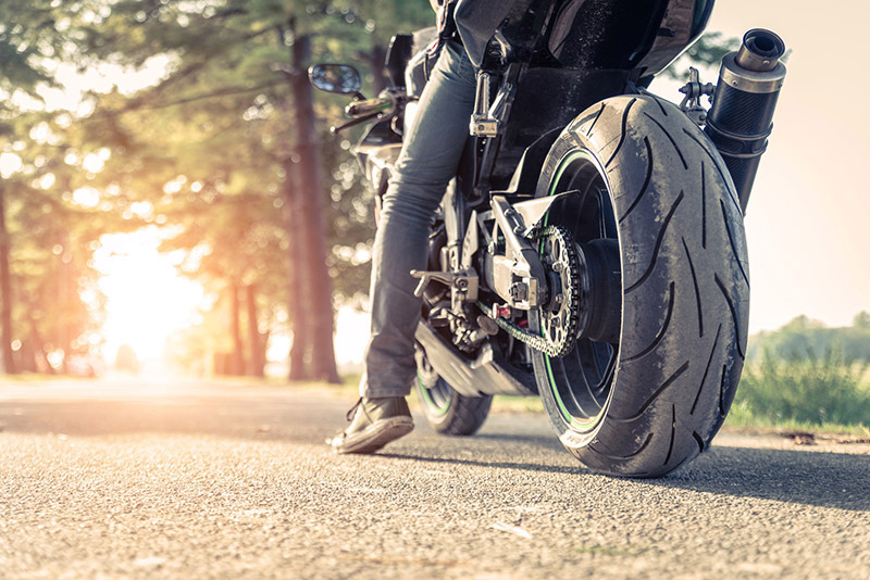 biker and motorbike ready to ride